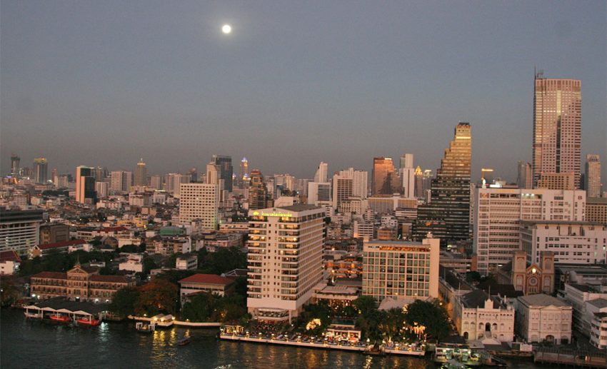 Full moon over Bangkok on Chao Phraya River
