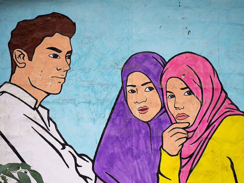 Mural of Muslim girls and a man in Lavapiés, Madrid. (Pic credit: r2hox/Flickr)