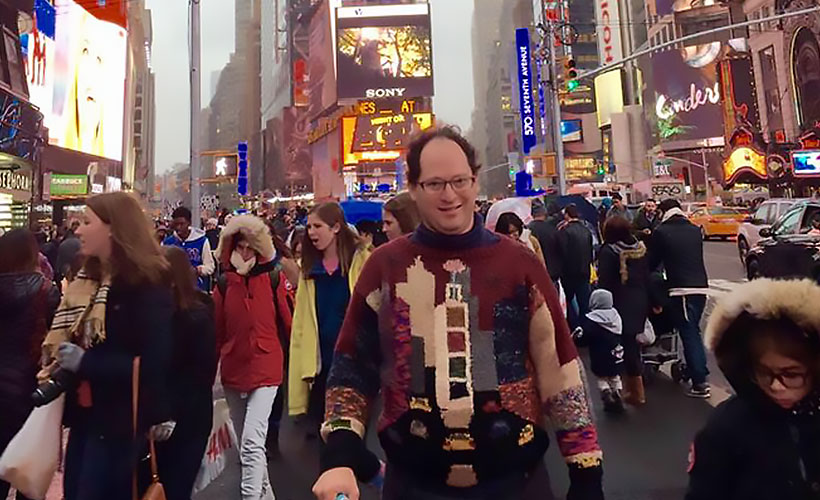 Sam wearing his Times Square sweater at Times Square, New York. (Photo credit: Sam Barsky)
