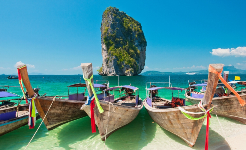 The iconic longtail boats of Thailand on a Krabi beach. (Photo Credit: Traveloka)
