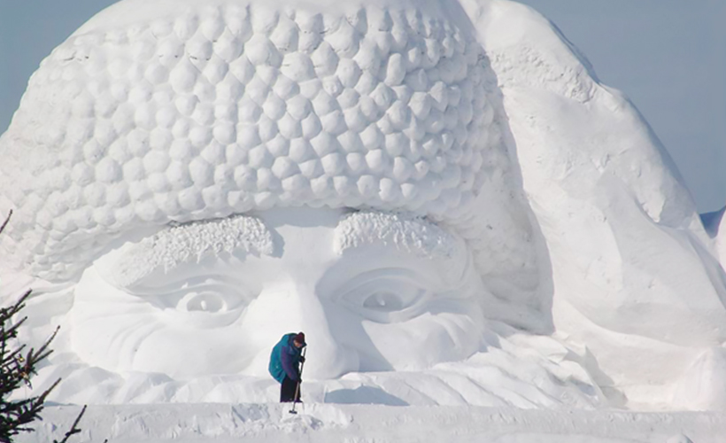 Here’s looking at you! A worker sweeping and smoothening the path in front of this snowy likeness of Santa Claus. https://www.harbinice.com/fact-v21-harbin-international-snow-sculpture-competition.html 
