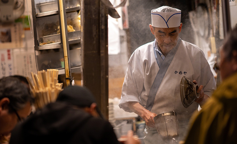 An izakaya owner prepping meals for his customers