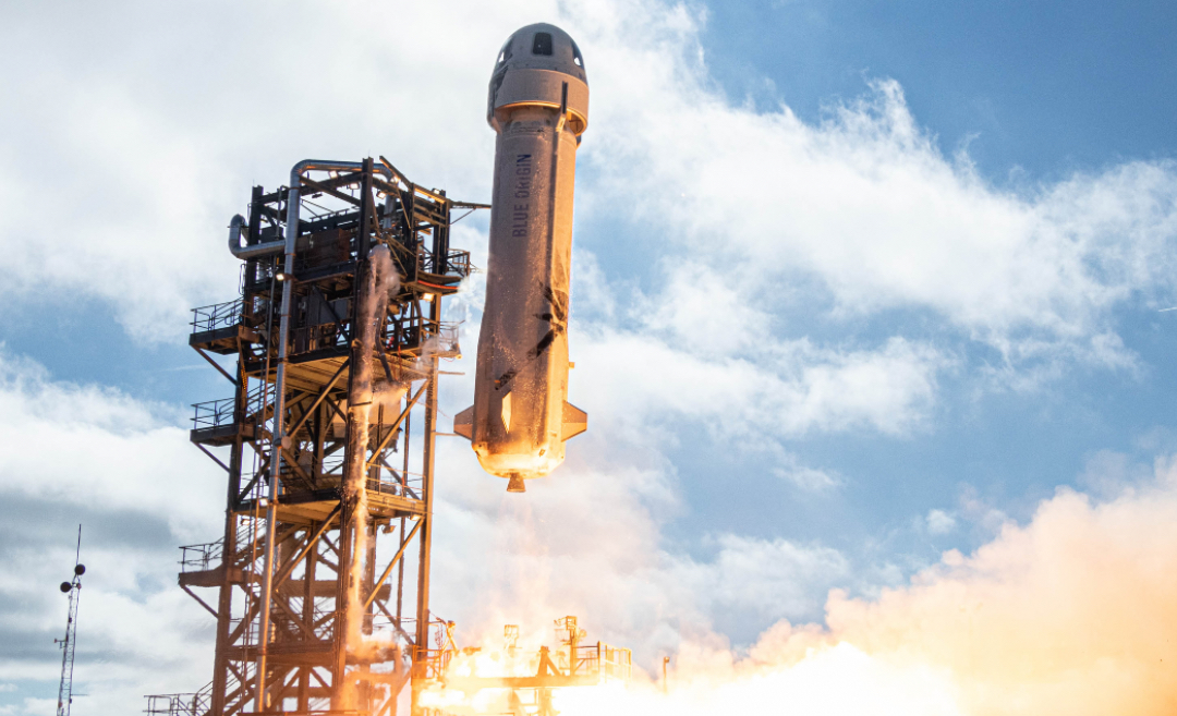 blue origin rocket lifts off