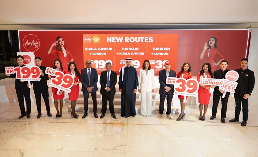AirAsia X media event launch for the Bahrain and London Gatwick route featuring Tony Fernandes and flight crew with promotional signage.