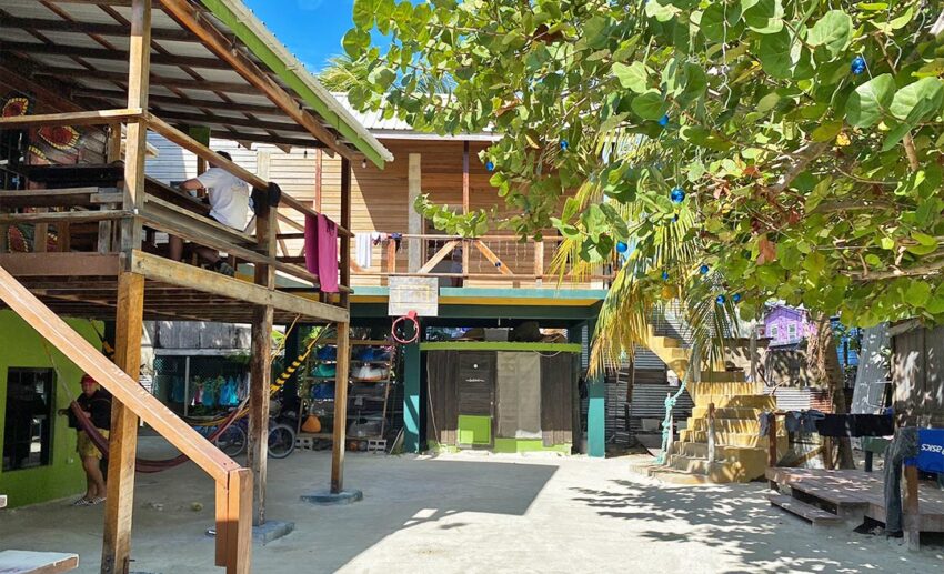 The exterior view of Bella’s Backpackers Hostel in Caye Caulker, showing the laid-back, colourful architecture typical of the island.