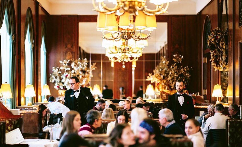 The bustling, grand interior of Café Landtmann in Vienna.
