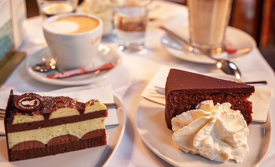 A close-up of Café Landtmann's traditional Austrian cake and coffee selection.