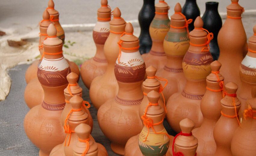 A collection of traditional Labu Sayong clay pitchers from Perak, known for their iconic gourd shape and ability to keep water naturally cool.