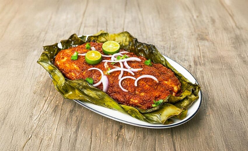 A traditional serving of spicy Portuguese baked fish, a signature culinary dish of the Melaka Portuguese-Eurasian community.