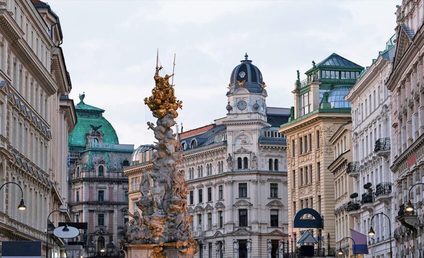 An architectural shot of the historic clock tower in Graben, showcasing Vienna’s imperial Habsburg history.