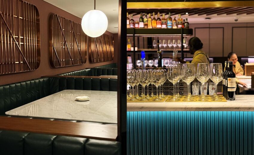 The plush green leather booth seating and elegant wine glasses lined up at the bar of JIN Gastrobar in The Gardens Mall.