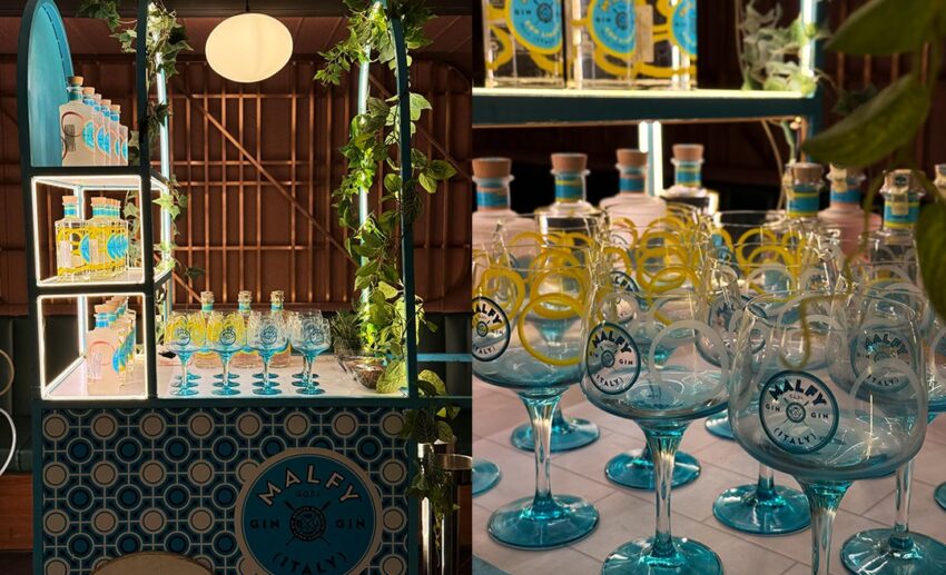 The Malfy Gin booth featuring botanical decor and gin bottles during the menu tasting event at JIN Gastrobar.