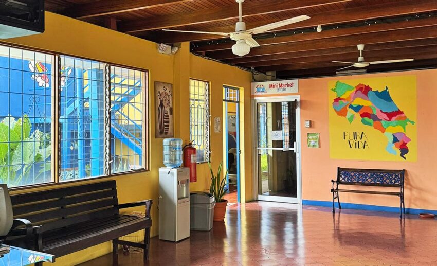 The interior of a local school in Liberia where the writer worked, featuring a bright wall mural with the iconic Costa Rican phrase "Pura Vida."
