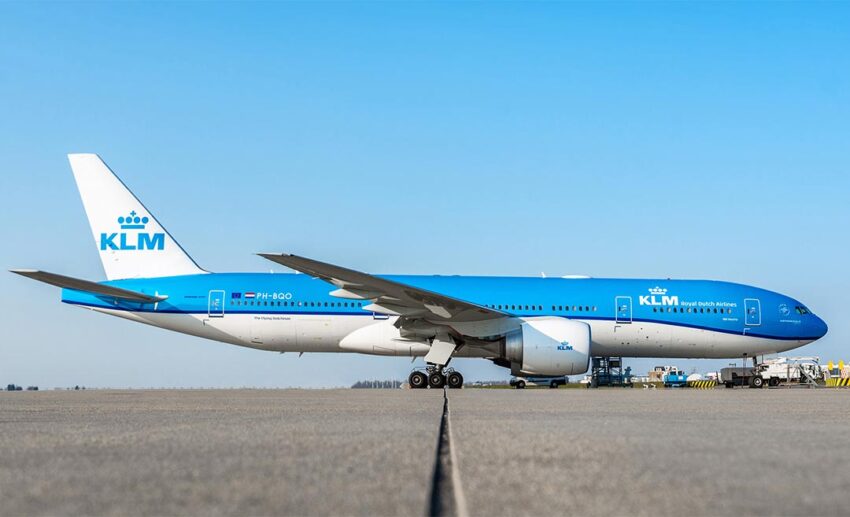 A blue and white KLM Royal Dutch Airlines plane on the tarmac at Schiphol Airport, the primary transit hub for travellers flying from Kuala Lumpur to the Netherlands.