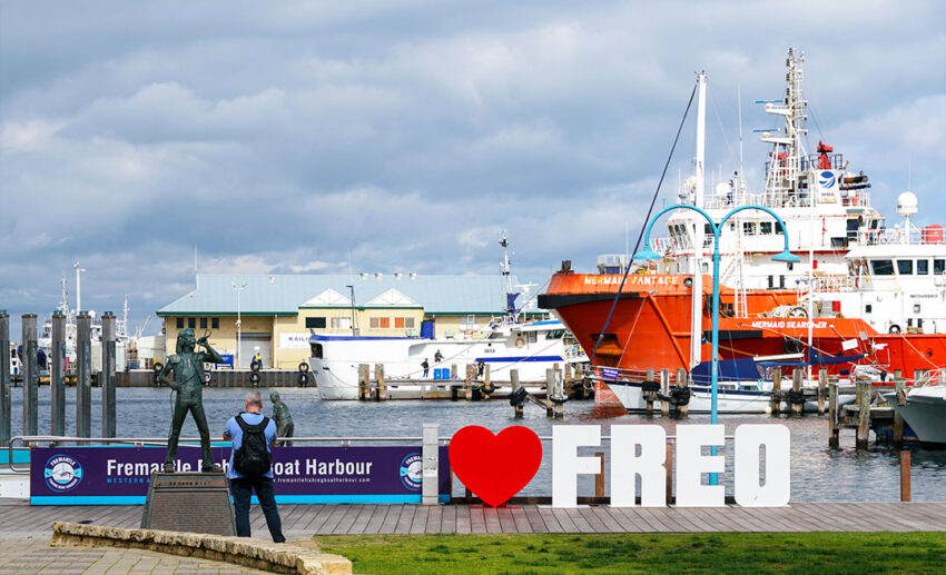 The Fremantle Fishing Boat Harbour in Western Australia, featuring the "I Love Freo" sign and the bronze tribute statue of AC/DC’s Bon Scott.