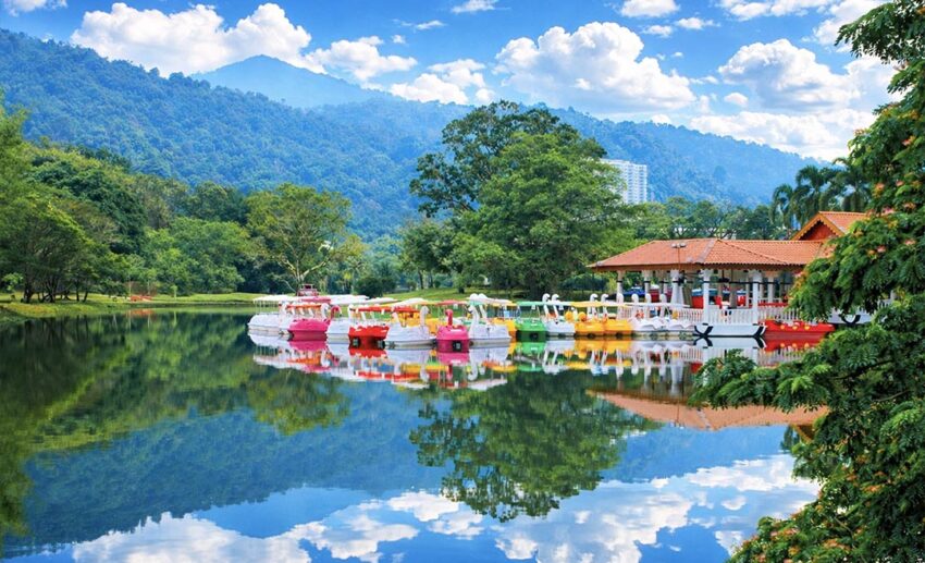 Colourful paddle boats moored at the dock, ready for a slow boat ride across the lakes in Taiping.