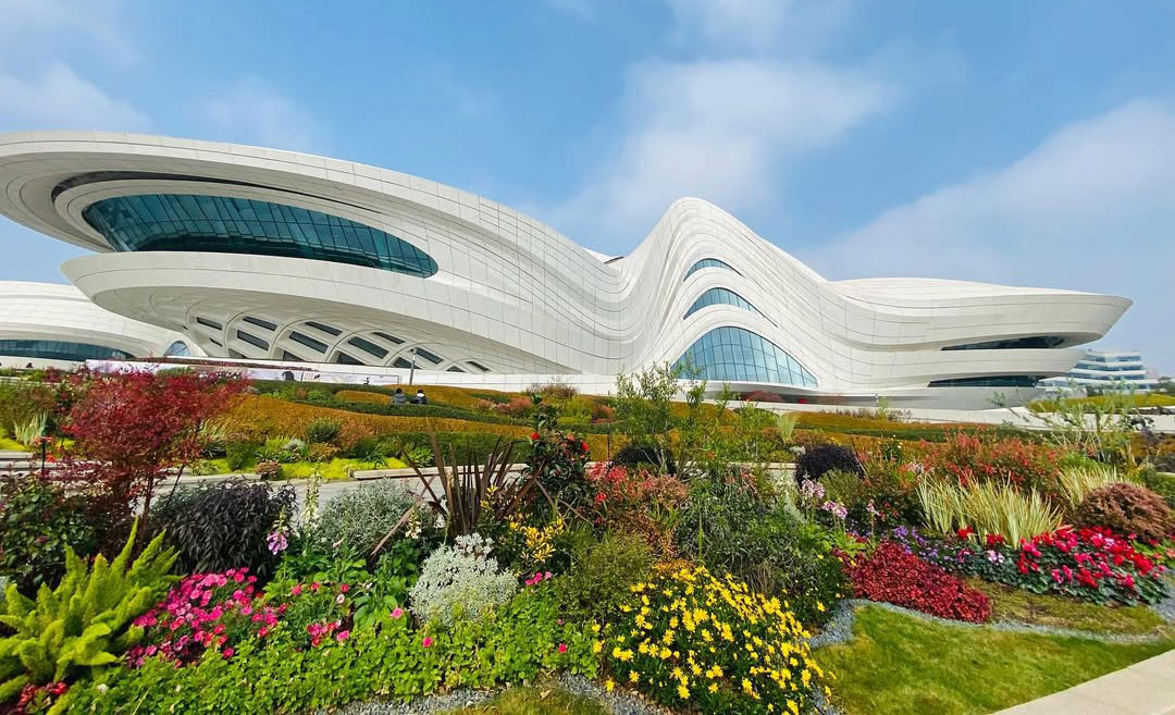 The striking white, fluid architectural facade of the Meixihu International Culture & Arts Centre in Changsha, China, designed by Zaha Hadid.