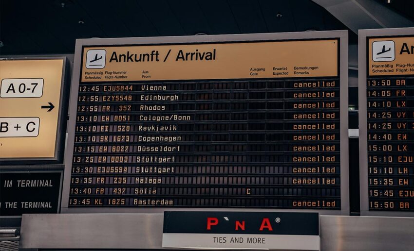 A close-up of a flight departure board at Berlin Tegel Airport during a period of disruption, displaying multiple cancelled flights.