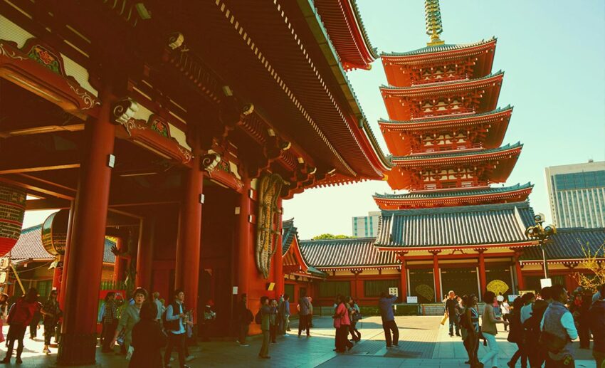 The main courtyard of Senso-ji Temple in Tokyo, Japan, filled with tourists and visitors during peak hours.