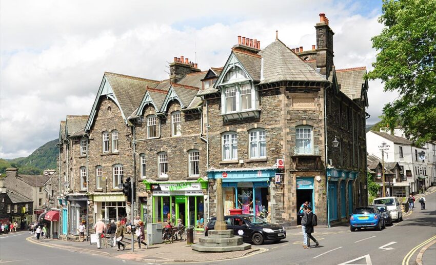 A charming street view of local shops and Victorian-style slate buildings in the town of Ambleside, Lake District.