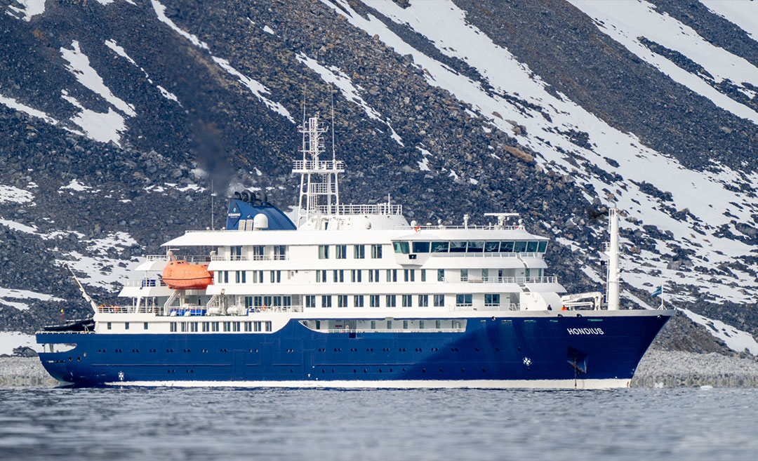 The Hondius cruise ship sailing on calm blue water, representing the vessel linked to recent hantavirus contact tracing efforts.