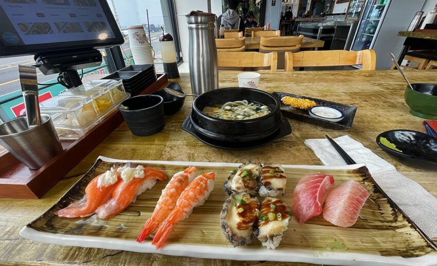 A freshly prepared plate of local sea-to-table abalone sushi served as a fresh lunch on Jeju Island.