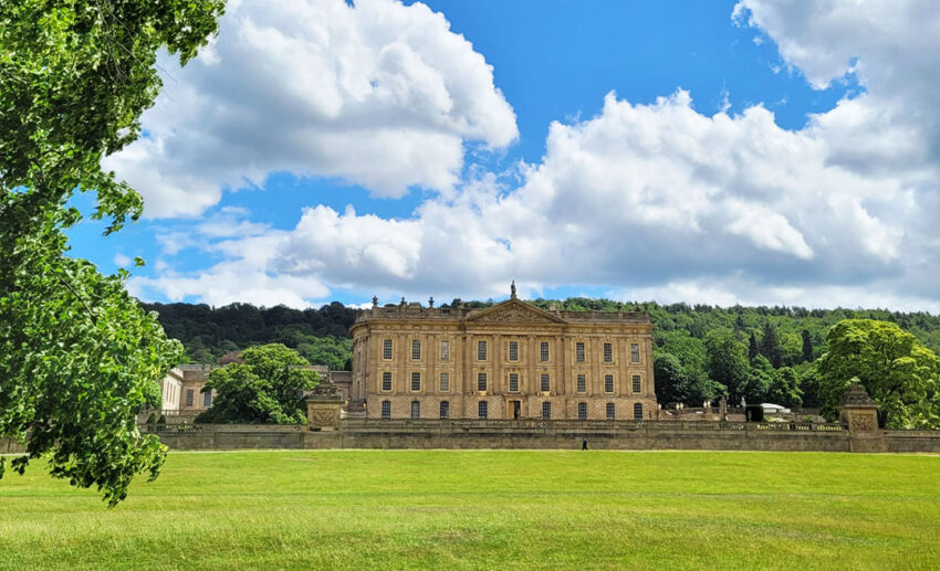 Detailed view of the grand exterior stone architecture of Chatsworth House in Derbyshire