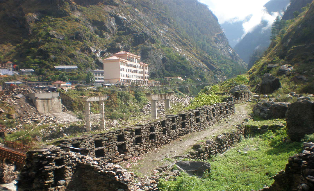 The China–Nepal Gyirong Port border crossing at Rasuwa Fort under construction in 2013, showing mountain terrain before the 2026 floods.