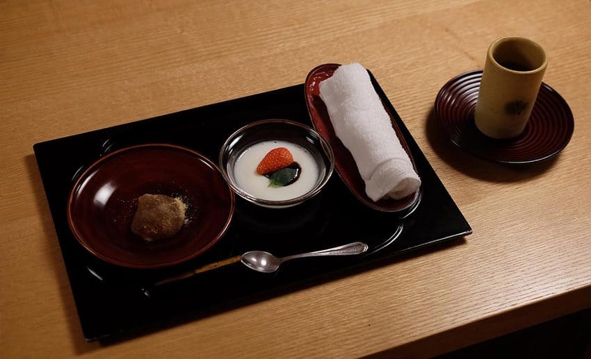 Traditional Japanese multi-course meal, regional sake, and hot spring preparation in snowy Aizu.