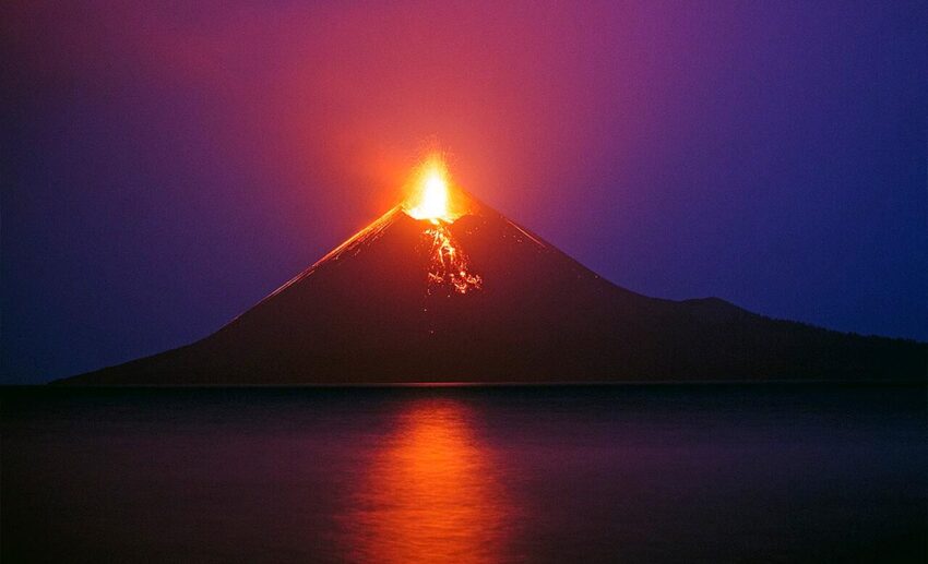 Historic 2018 photograph of Mount Anak Krakatau spewing lava, steam, and ash plumes into the sky prior to its partial collapse in the Sunda Strait.