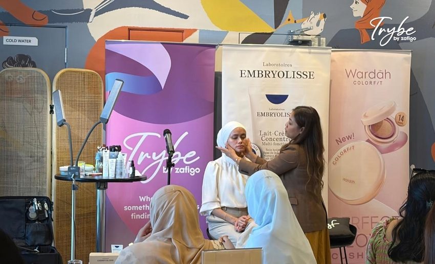 Professional make-up artist Ummi Nasir demonstrating skin preparation and base application techniques on model Umi Atiqah.
