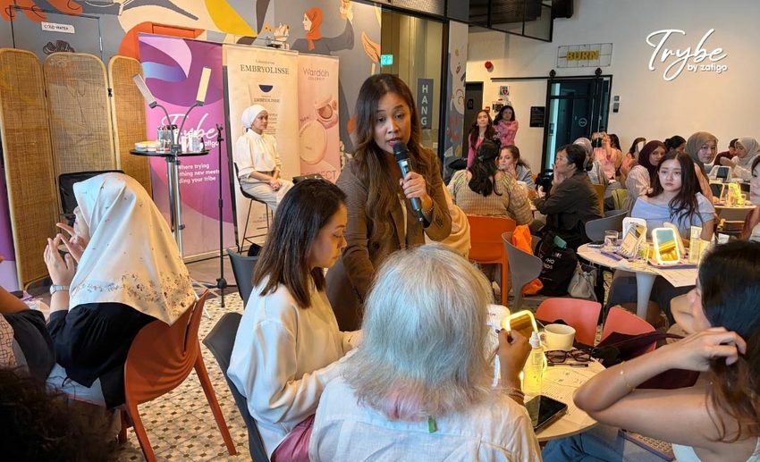 Professional MUA Ummi Nasir assessing participants' make-up routines and offering personalised advice at a masterclass table.