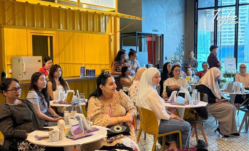 Participants actively listening and taking notes during the Trybe By Zafigo travel skincare and beauty masterclass.