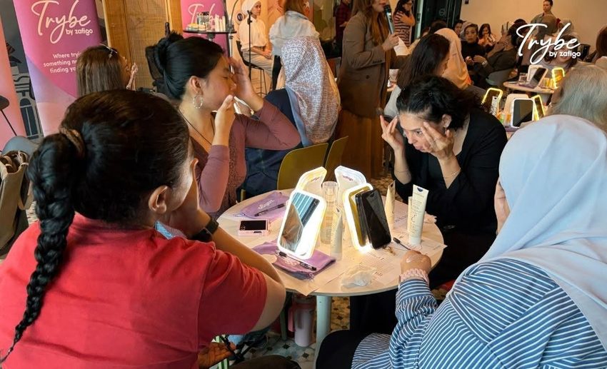 Table of female participants applying skincare products to prep their face and combat post-flight dryness and puffiness.
