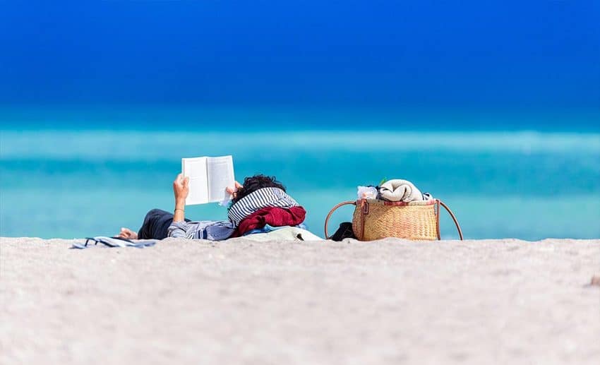 A tranquil, open-air beach setting, encouraging a slower travel pace.
