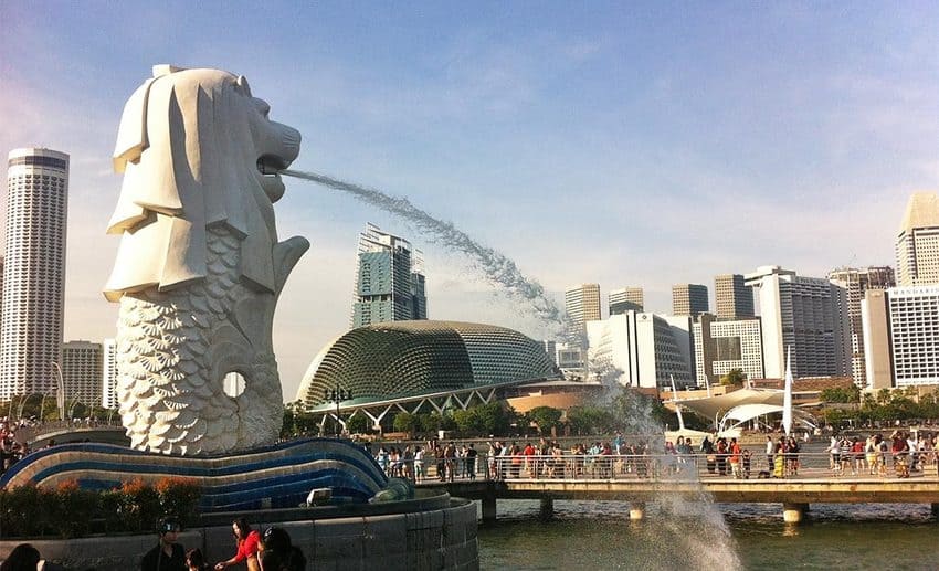 The iconic Merlion statue spouting water against the Singapore city skyline during Jessica Holmes's heritage trip.