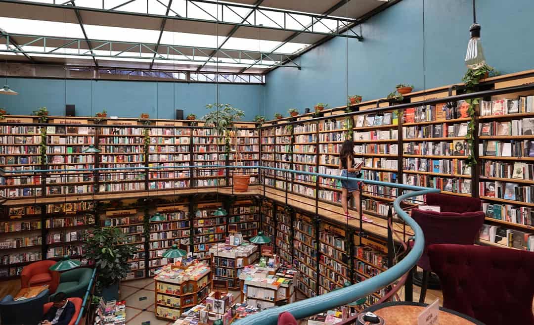 The towering wooden bookshelves and vibrant reading spaces inside the Biblioteca Vasconcelos in Mexico City.